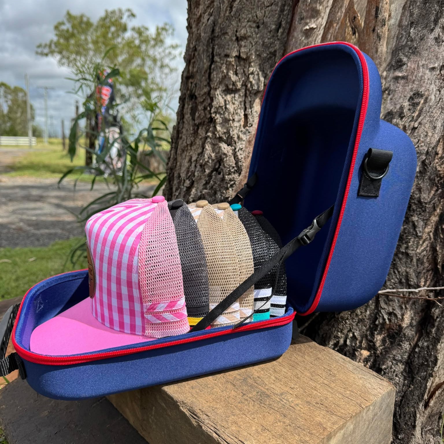 Open trucker cap case displaying one high-profile trucker cap inside