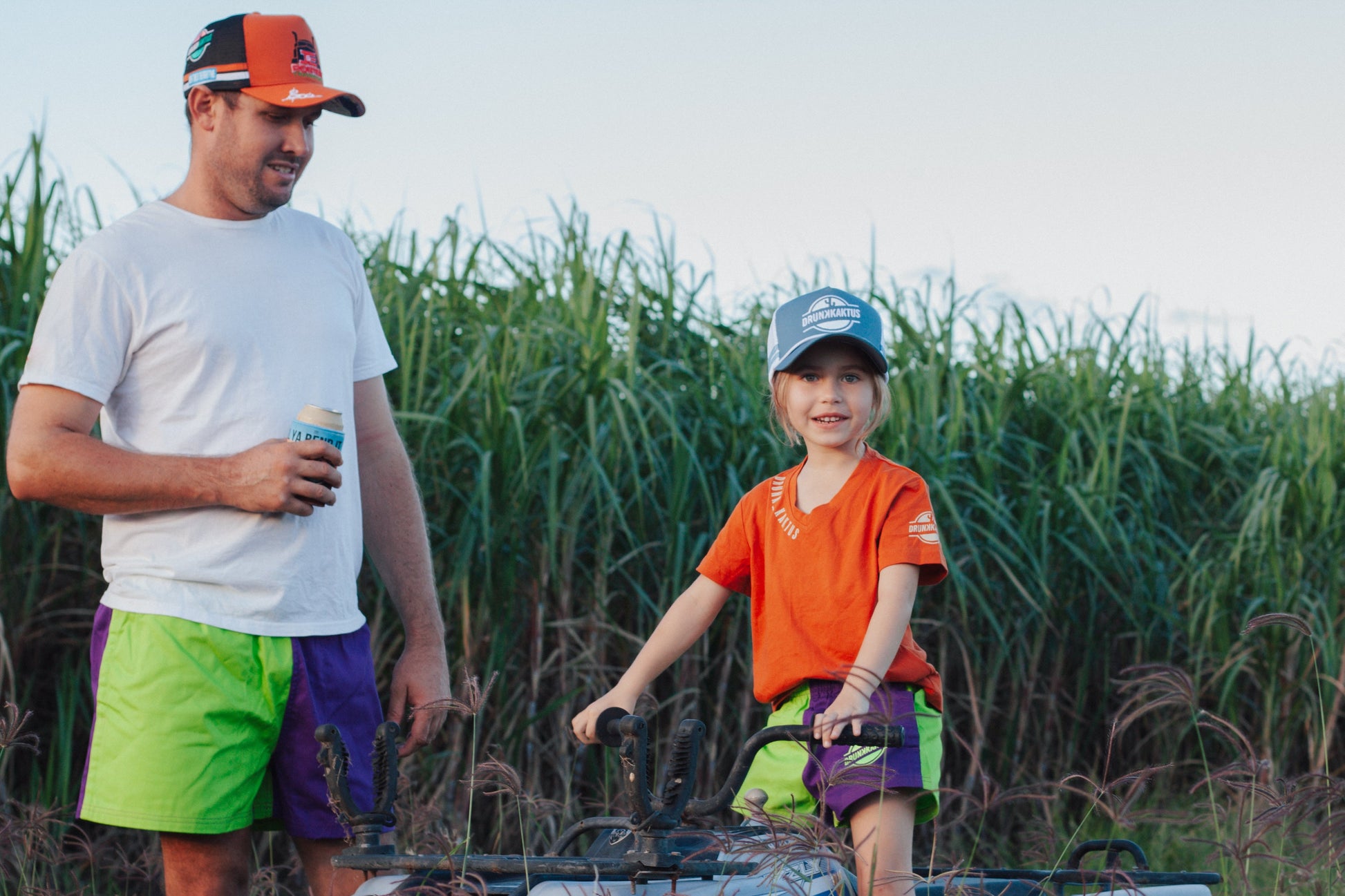 Model wearing green purple cotton drill shorts