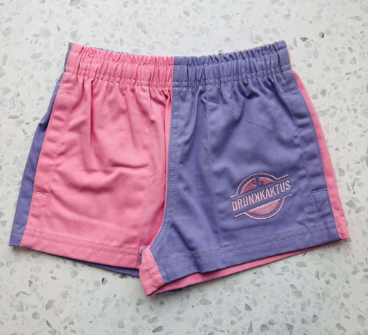 Front view of kids pink purple shorts made from cotton drill fabric, showing elastic waistband and drawstring for a comfortable fit.