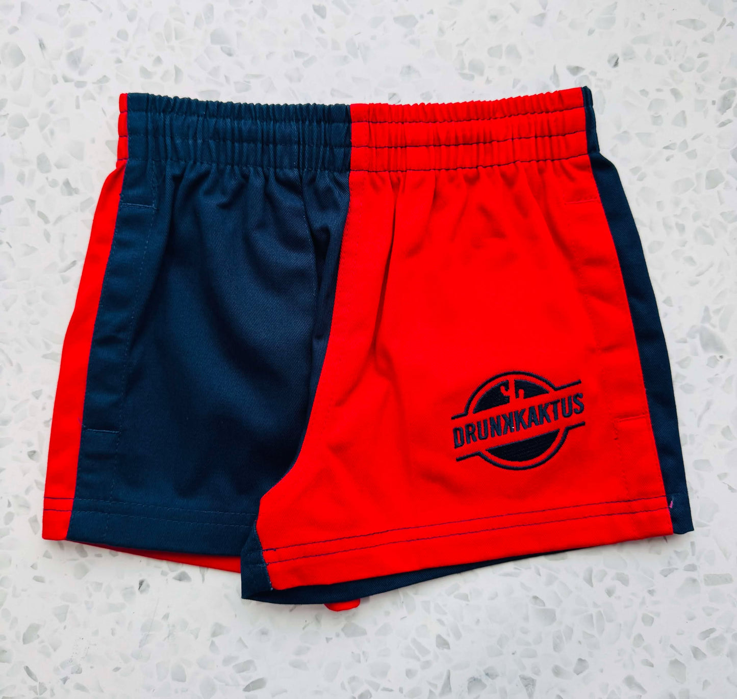 Navy red cotton drill shorts from RUGGERS, featuring comfortable design and durable fabric for everyday wear.