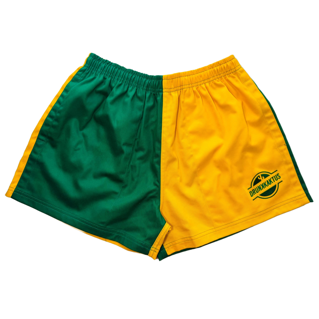 Close-up of green gold cotton shorts highlighting two-tone design and deep pockets