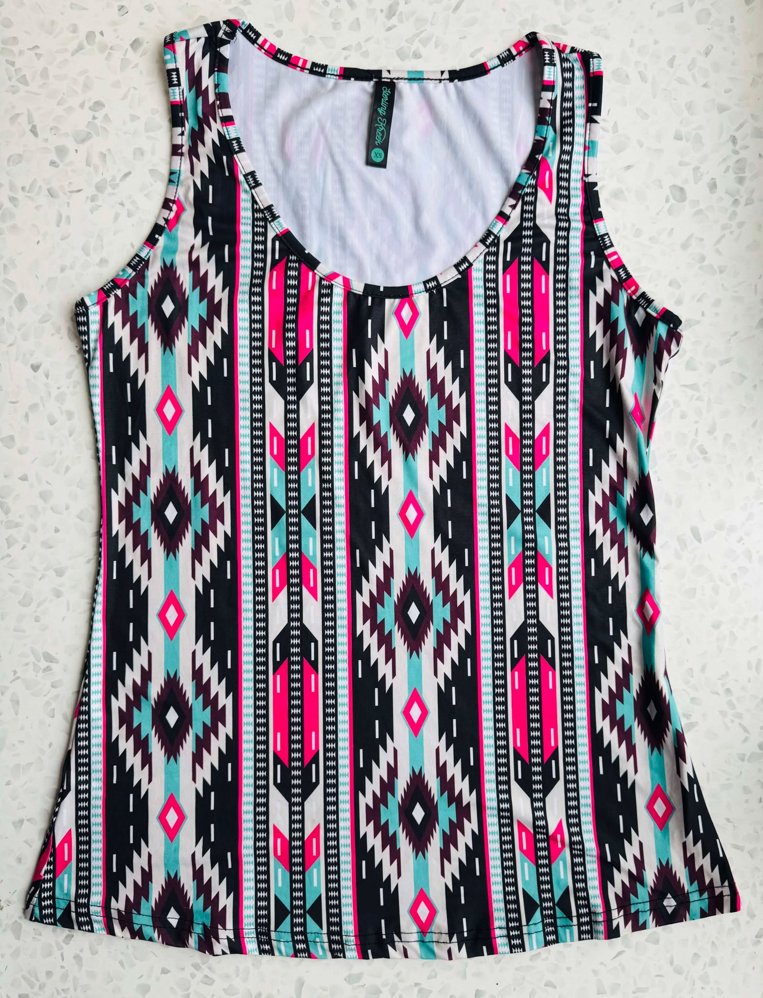 A Multicolored Geometric Ladies Singlet patterned ladies singlet.