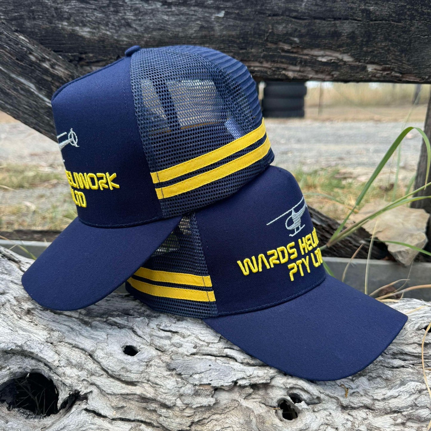 Design your own trucker cap in navy blue with yellow stripes and customized logo.