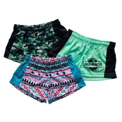 Kids Footy Shorts in teal displayed alongside other sportswear products, highlighting durable fabric, quick-dry design, and comfortable fit for active kids.