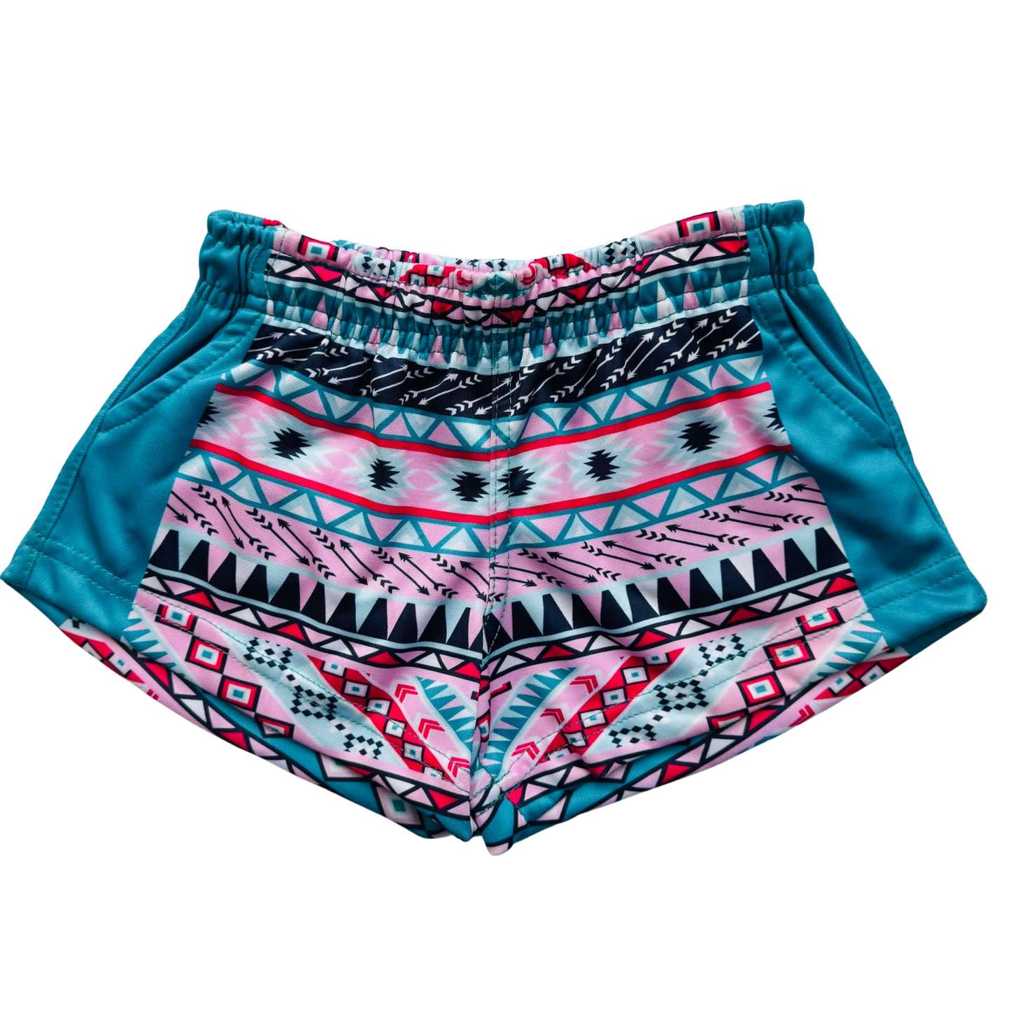 Close-up view of Kids Footy Shorts in AZTEC, showing elastic waistband, drawstring, and deep pockets made from lightweight sublimated polyester fabric.