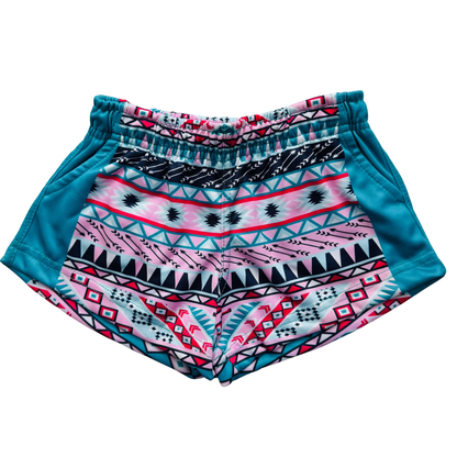 Close-up view of Kids Footy Shorts in AZTEC, showing elastic waistband, drawstring, and deep pockets made from lightweight sublimated polyester fabric.