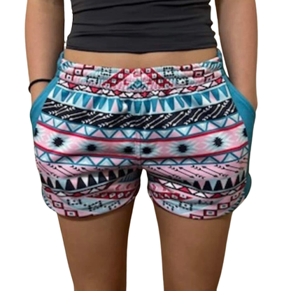 A kid pair of FOOTY SHORTS - AZTEC  WITH POCKETS with pockets and an elastic waistband