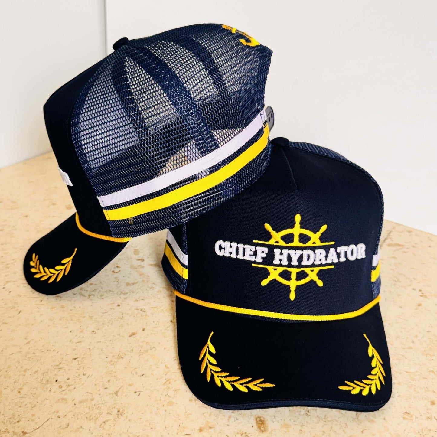 High Profile Trucker Cap- Chief Hydrator High-Profile Mesh Cap in Black and Gold with Structured Crown.