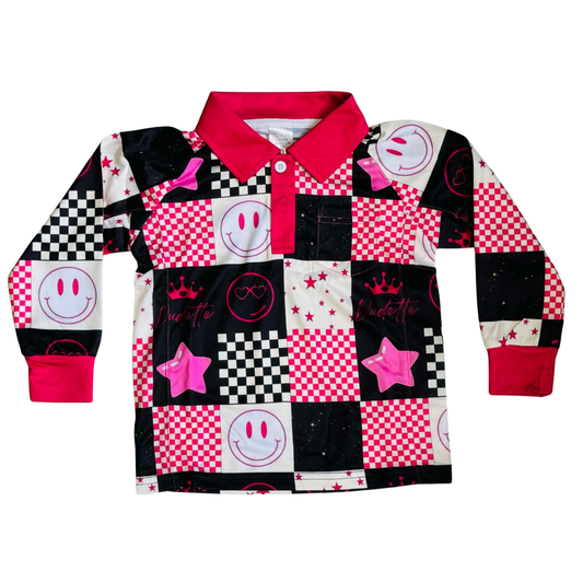 Colorful patchwork shirt with smiley faces, stars, and checkered patterns on a white background