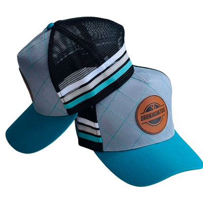 Colorful TEAL_DIAMOND cap with a Drunk Kaktus logo on a white background
