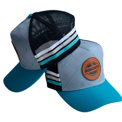Colorful TEAL_DIAMOND cap with a Drunk Kaktus logo on a white background